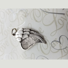 This custom pendant features an angel wing on half and a fingerprint heart on the other half. Two sizes 18mm and 28mm. 