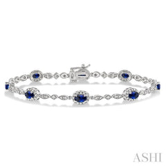 5x3 MM Oval Cut Sapphire and 1/20 Ctw Round Cut Diamond Bracelet in 10K White Gold