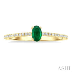 5x3 MM Oval Cut Emerald and 1/10 Ctw Petite Round Cut Diamond Precious Fashion Ring in 10K Yellow Gold